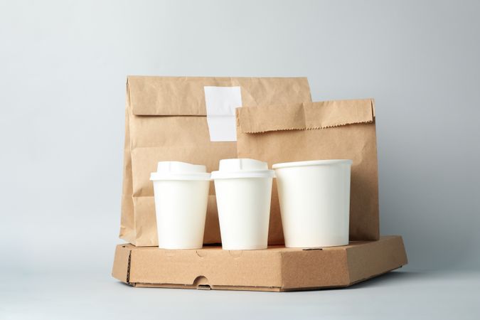 Food delivery mockup on light gray background, space for text