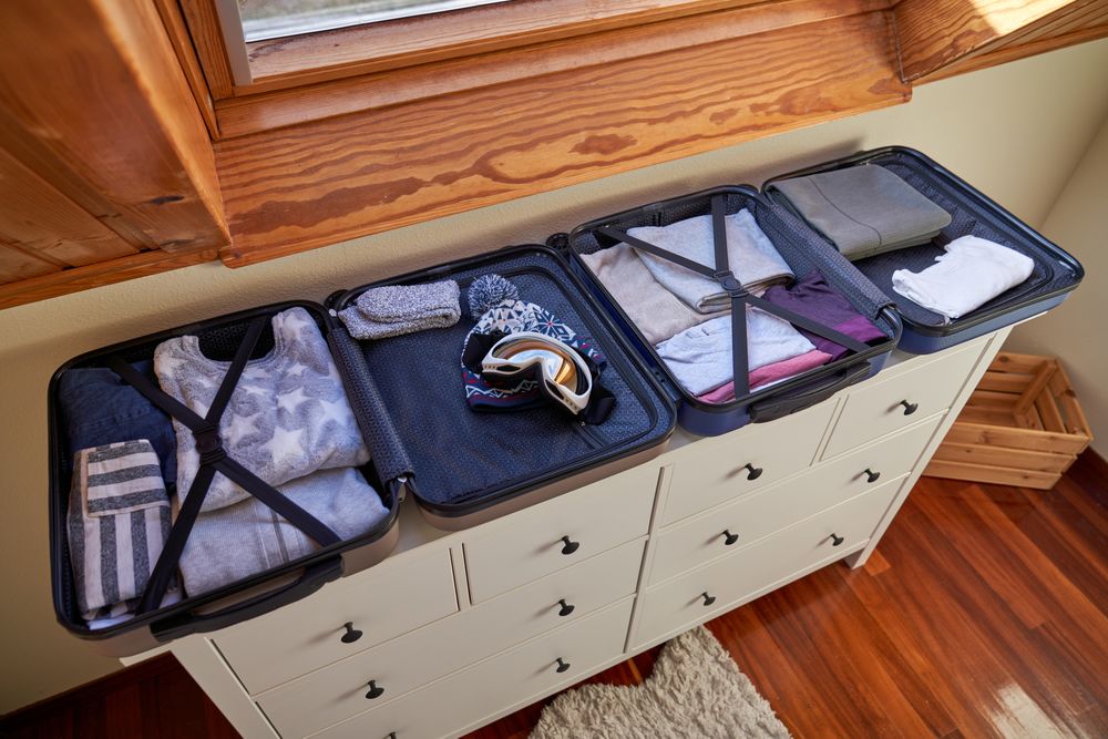 Open luggages on wooden cabinet