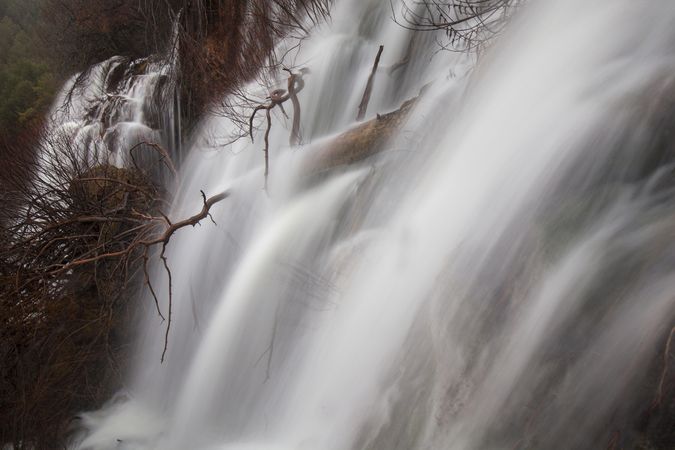 Wonderful waterfall near tree