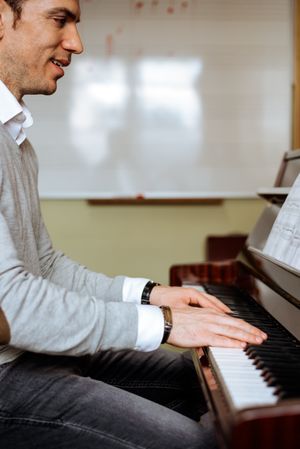 Man playing piano in studio
