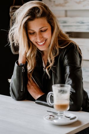 Woman drinking coffee from a glass