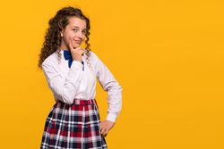 Girl with hand on chin, thoughtful expression