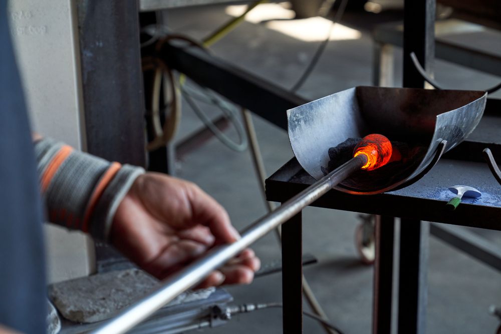 Anonymous glassblower cooling down hot object