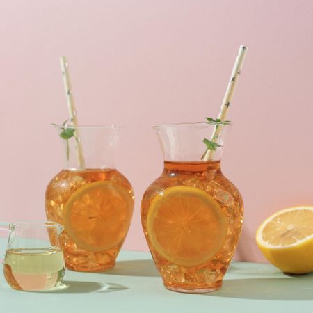 Two carafes of ice tea with mint garnish