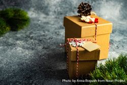 Two Christmas presents wrapped with decorative snowflakes bGdEV0