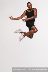 Action shot of athletic male jumping in mid air 4NnnZ4