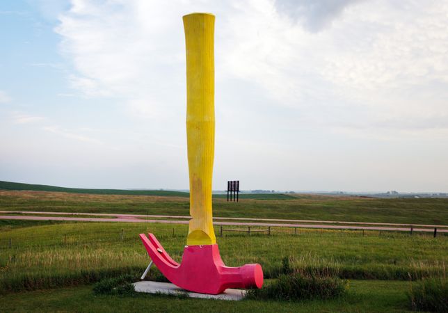 Upside down pink and yellow hammer, Porter Sculpture Park, Montrose, South Dakota