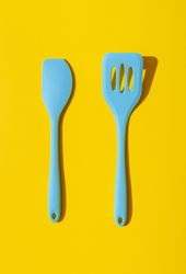 Kitchen utensils isolated on a yellow background