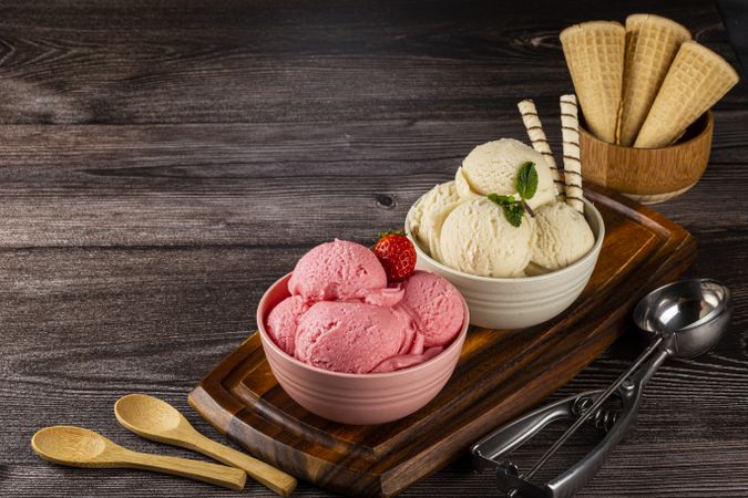 Bowls with strawberry and vanilla ice cream.