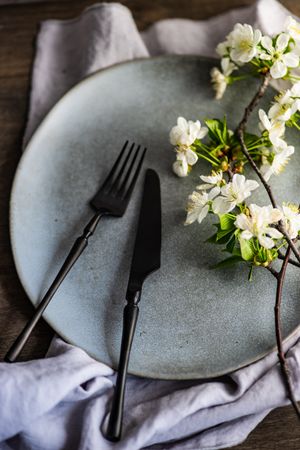 Spring table setting with buds on plate