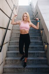 Woman flexing muscles with sportswear