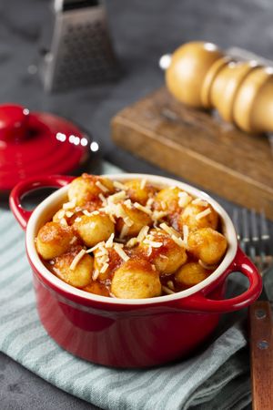 Gnocchi with tomato sauce and grated Parmesan cheese.