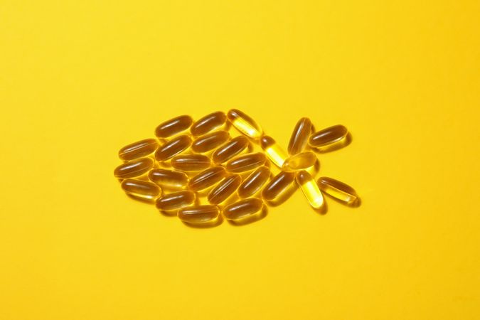 Omega pills in the shape of a fish