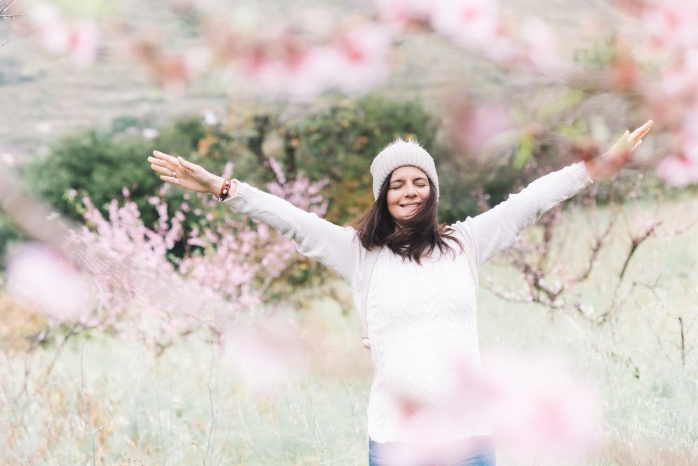 Happy woman in spring countryside