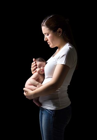 Mother holding a newborn in her belly