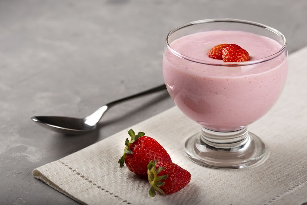 Delicious strawberry mousse in glass goblet.