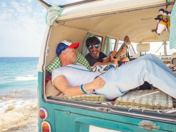 Men relaxing in van
