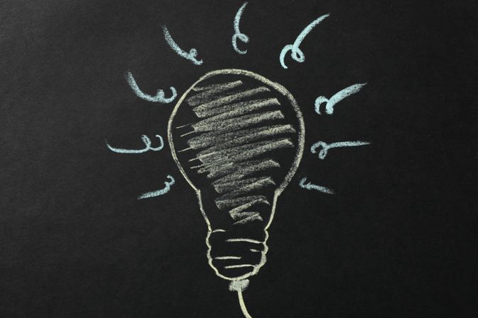 Chalk bulb on dark background. Good idea concept