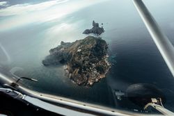 Flight over islands in the middle of the sea
