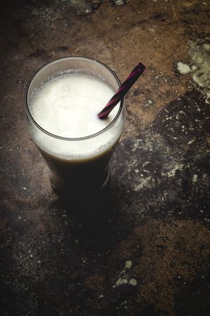 Glass of milk on table