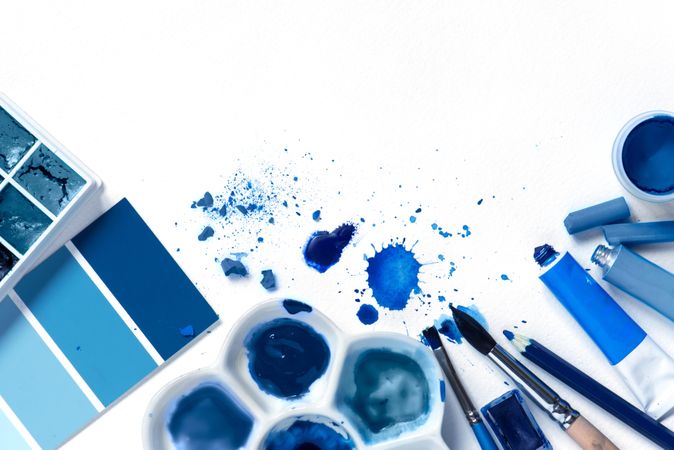 Blue paint on bright background with copy space