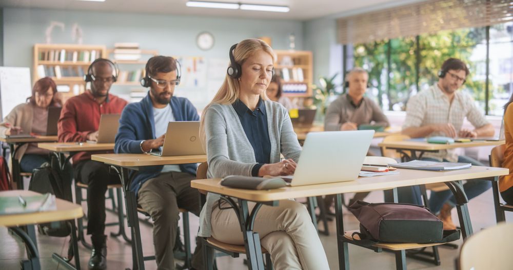 Multiethnic Women and Men of Different Age Acquiring New Academic Skills in Modern Classroom.