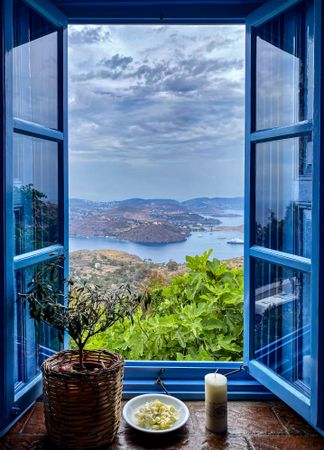 Blue window with a view on Skala