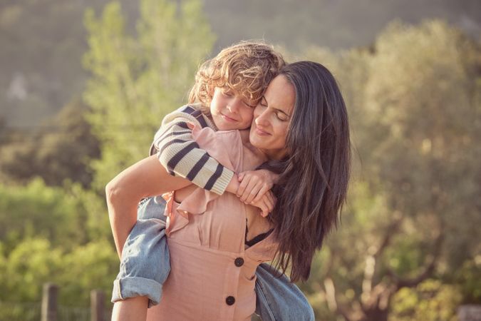 Happy mother with son in park