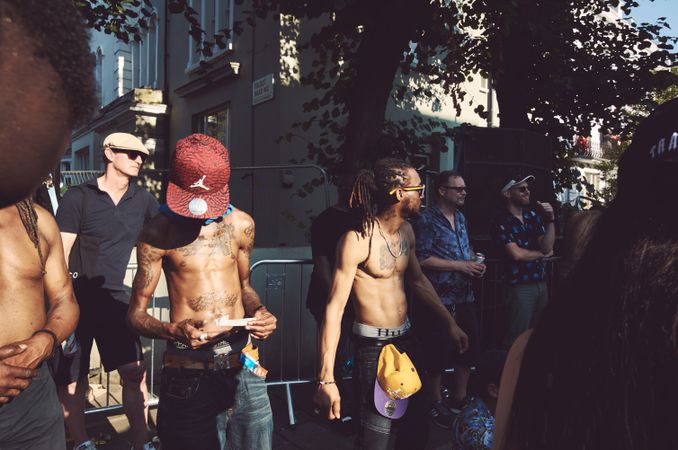London, England, United Kingdom - August 25th, 2019: Tattooed men at Notting Hill Carnival