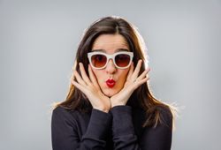 Woman with sunglasses and red lips gesturing