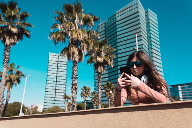 Teen girl looking at her smartphone.