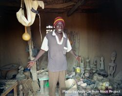 Dogon country, Mali - Mar 10, 2007 - Malian artisan showing wares 0VwQO5