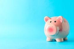 Happy piggy bank on color background, space for text. Finance, saving money