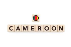 Wooden blocks bearing the name and flag of Cameroon. Cameroonian and African Culture, national identity, travel, and geography in a copy space design.