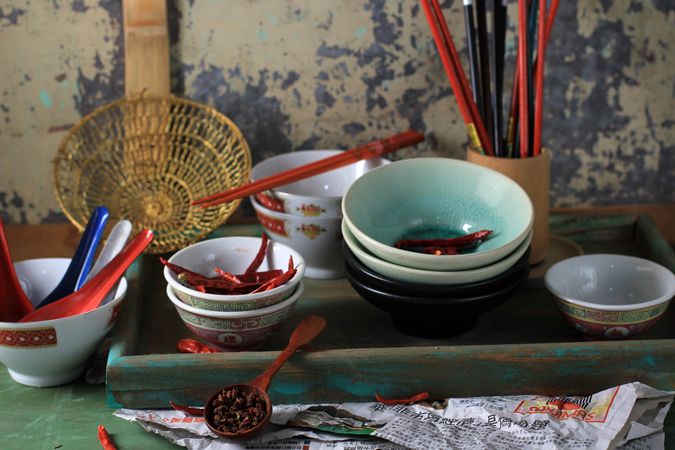 Bowls and Spoon with Rustic Background and Sun Dried Chilli
