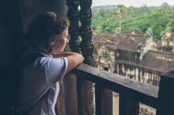 Female tourist looking at old temple