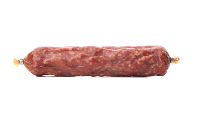 Encased cured meat lying on plain background