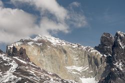 Mountain peak abutting sky in desert valley