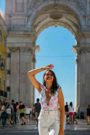 Woman showing standing near arch