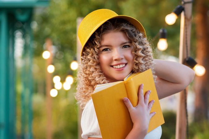 Woman with book outdoors
