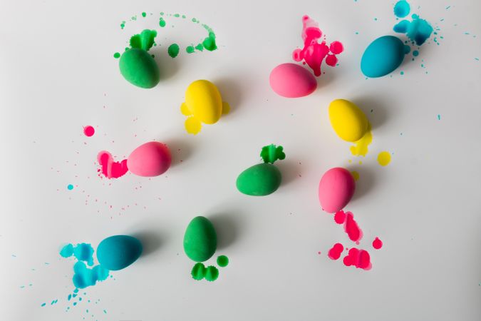 Top view of colorful Easter eggs on light background with vibrant dye