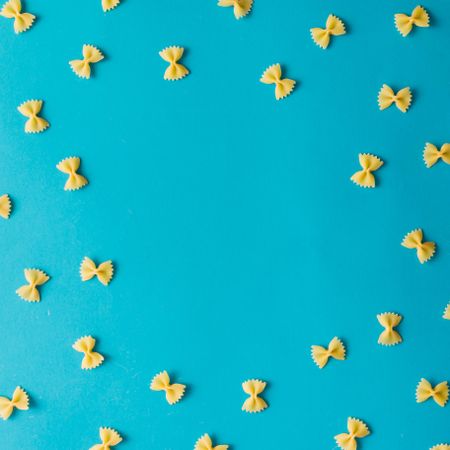 Pattern made of pasta on blue background