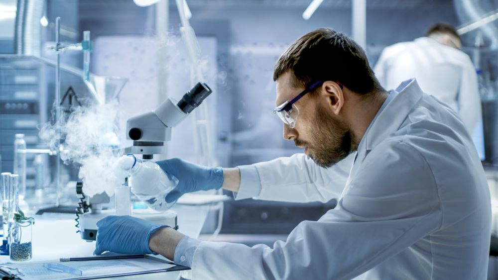 In a Chemical Research Laboratory Scientist Mixes Smoking Compounds in Beakers.