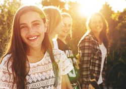 Group of female friends smiling in the sun