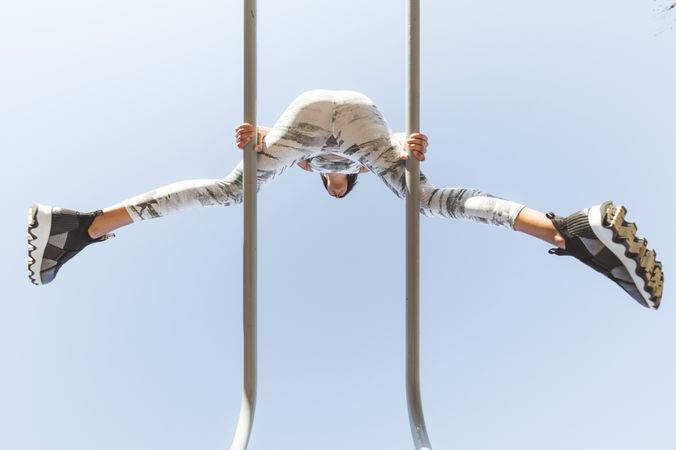 Woman training on parallel bars