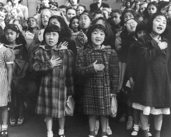 Children of the Weill public school shown in a flag pledge ceremony San Francisco, CA, April 1942