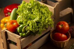 Box of fresh produce on wooden table