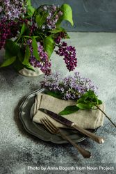 Spring table setting with lilacs on rustic napkin 48B7NR
