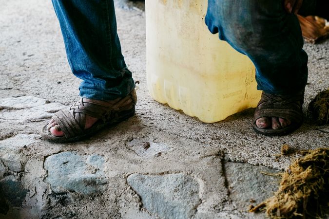 adult man resting on bucket