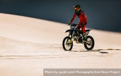 Moto racer riding bike in desert 43Omr4